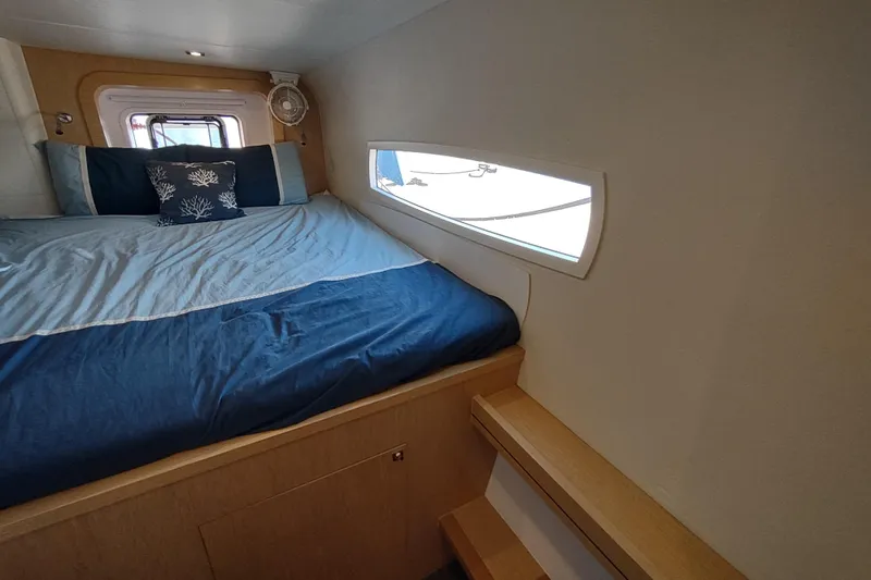 Slide: The Image of Cozy cabin interior of 2020 Outremer 51 yacht with bed and window view. - 78