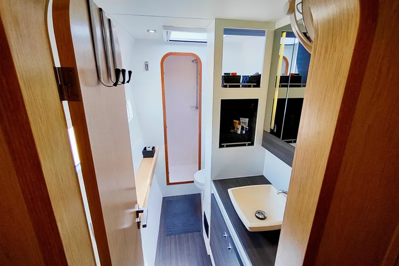 Slide: The Image of Interior of 2020 Outremer 51 yacht bathroom with modern fixtures and storage. - 82