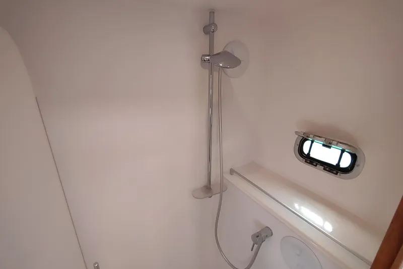 Slide: The Image of 2020 Outremer 51 yacht bathroom with shower and porthole window. - 85
