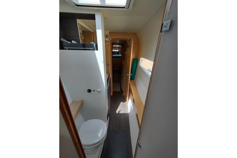 Slide: The Image of Interior of 2020 Outremer 51 yacht, featuring modern bathroom and hallway design. - 86
