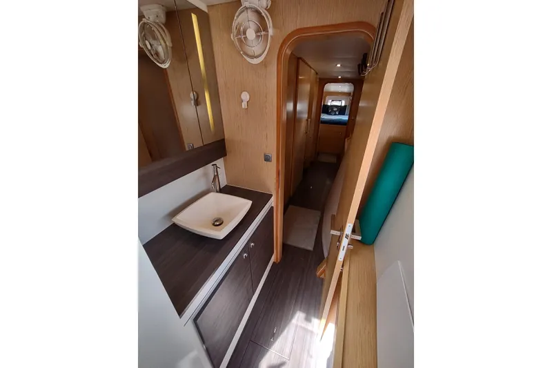 Slide: The Image of 2020 Outremer 51 yacht interior with modern bathroom and hallway view. - 87