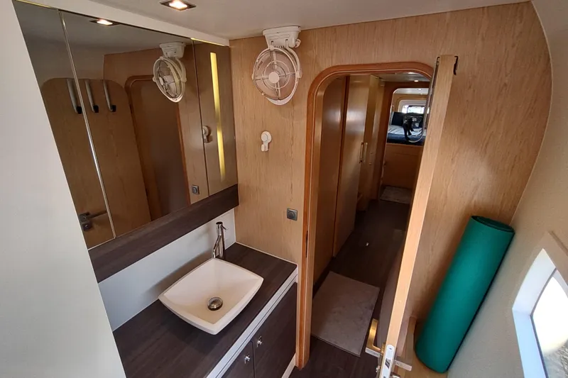Slide: The Image of Interior of 2020 Outremer 51 yacht, featuring a modern bathroom with a sleek sink. - 88