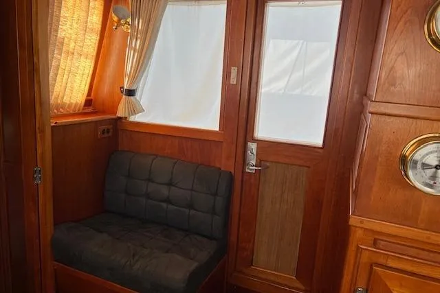 Slide: The Image of Port Side Access Door and Seat with Insulated Cooler Beneath - 37