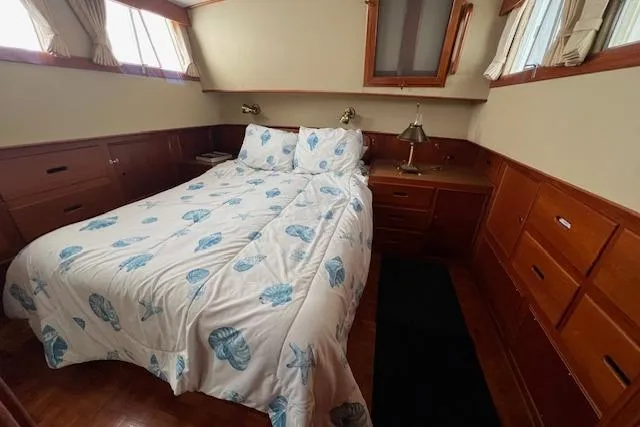 Slide: The Image of Master Cabin Island Queen Bed (aft) - 63