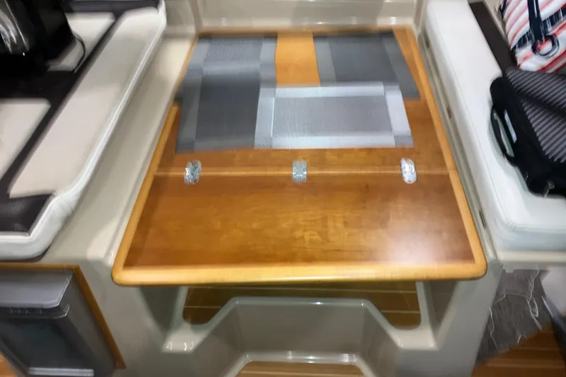Slide: The Image of 2017 Cutwater C-30 Sedan interior with wooden table and seating area. - 52