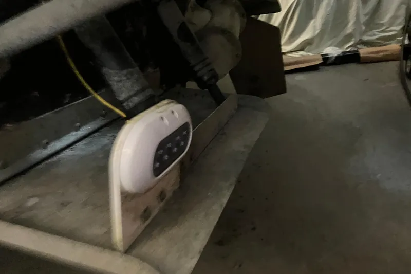 Slide: The Image of 2017 Cutwater C-30 Sedan boat detail, showing a mounted electronic device and wiring. - 110