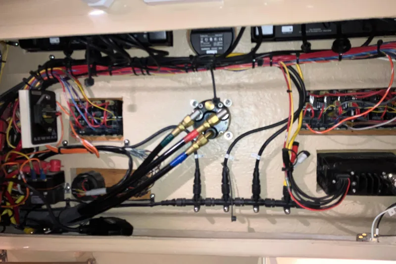 Slide: The Image of Electrical wiring and components inside a 2017 Cutwater C-30 Sedan boat. - 74