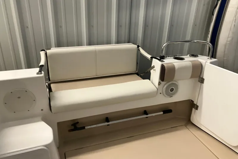 Slide: The Image of 2017 Cutwater C-30 Sedan boat interior with cushioned seating and storage. - 15