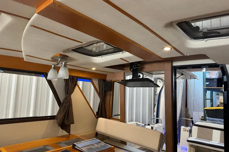 Slide: The Image of Interior of a 2017 Cutwater C-30 Sedan boat with modern furnishings and lighting. - 33