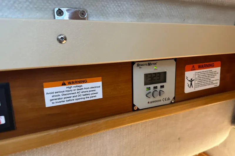 Slide: The Image of Control panel with warning labels on a 2017 Cutwater C-30 Sedan boat. - 29
