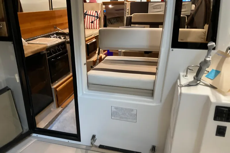 Slide: The Image of Interior view of 2017 Cutwater C-30 Sedan, featuring kitchen and seating area. - 21