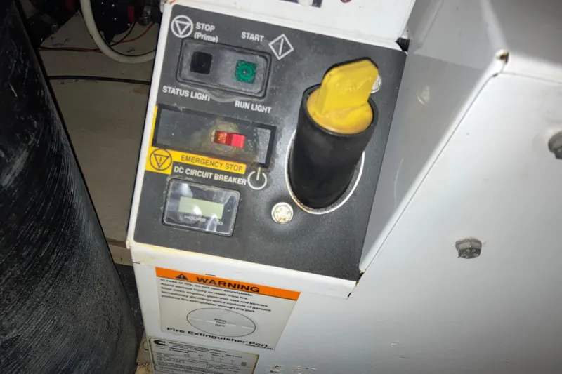 Slide: The Image of Control panel of a 2017 Cutwater C-30 Sedan with emergency stop and circuit breaker. - 88