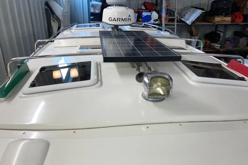 Slide: The Image of 2017 Cutwater C-30 Sedan boat roof with solar panel and Garmin radar. - 99