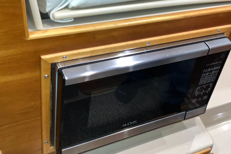 Slide: The Image of Built-in microwave in 2017 Cutwater C-30 Sedan boat interior. - 45