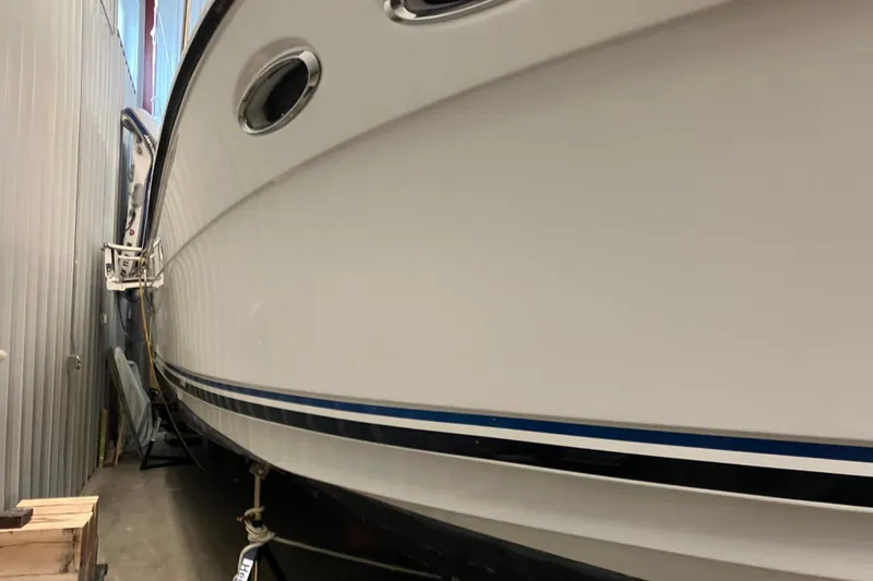 Slide: The Image of 2017 Cutwater C-30 Sedan boat stored indoors, side view. - 108