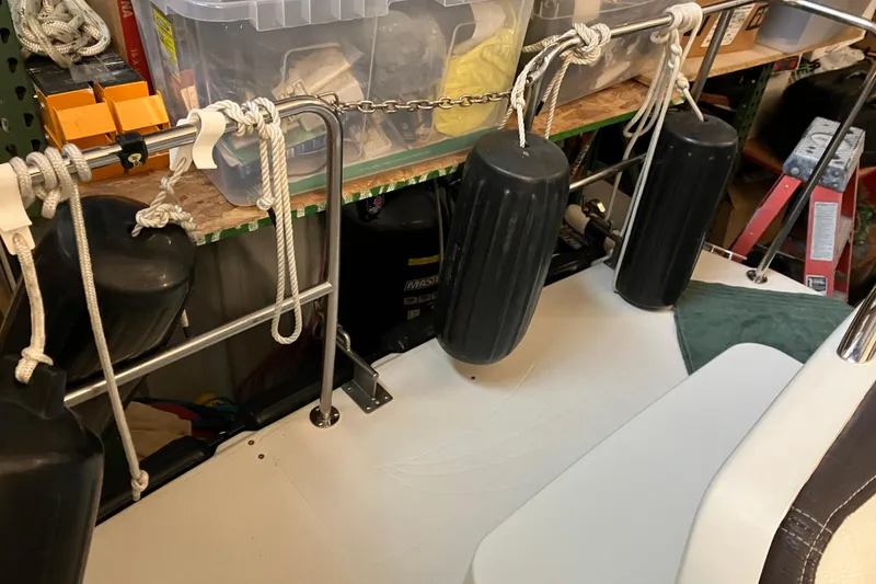 Slide: The Image of 2017 Cutwater C-30 Sedan boat deck with fenders and storage items. - 7