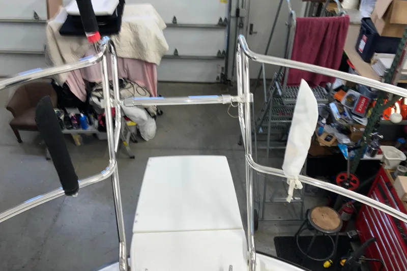 Slide: The Image of 2017 Cutwater C-30 Sedan boat interior with stainless steel railings in a garage setting. - 102