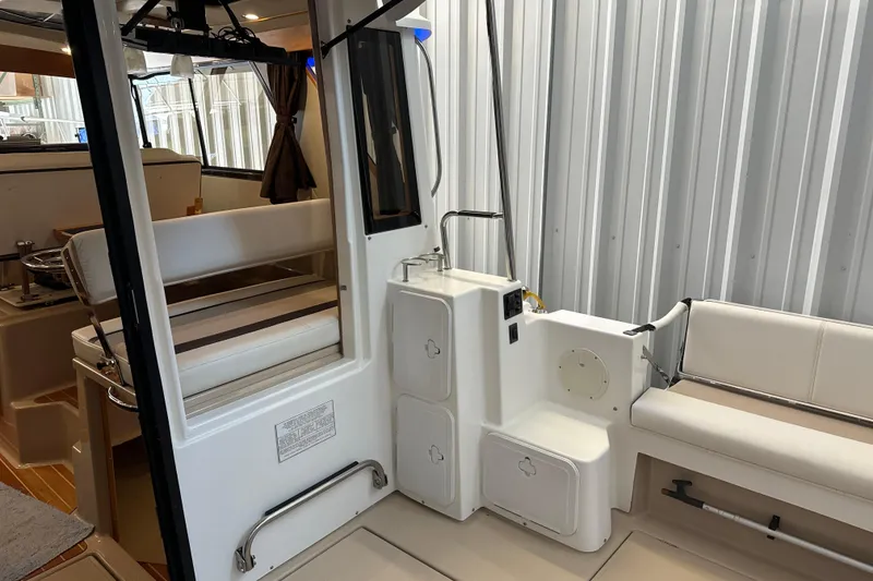 Slide: The Image of Interior view of 2017 Cutwater C-30 Sedan boat with seating and storage compartments. - 10