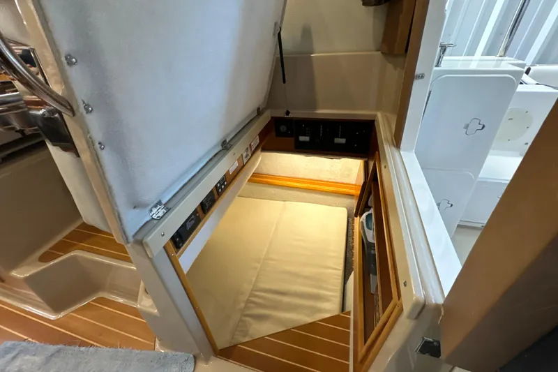 Slide: The Image of 2017 Cutwater C-30 Sedan interior cabin with storage and control panel. - 25