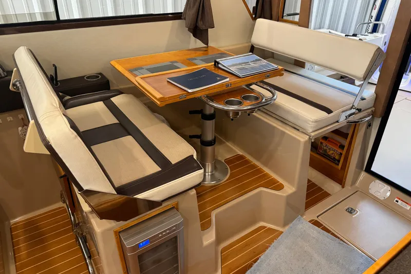 Slide: The Image of Interior of 2017 Cutwater C-30 Sedan with dining area and wooden flooring. - 34