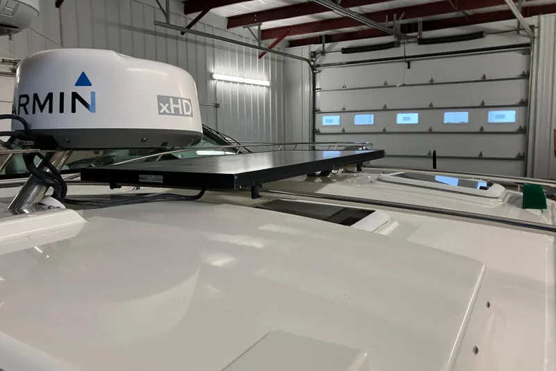 Slide: The Image of 2017 Cutwater C-30 Sedan with Garmin xHD radar in a garage setting. - 94