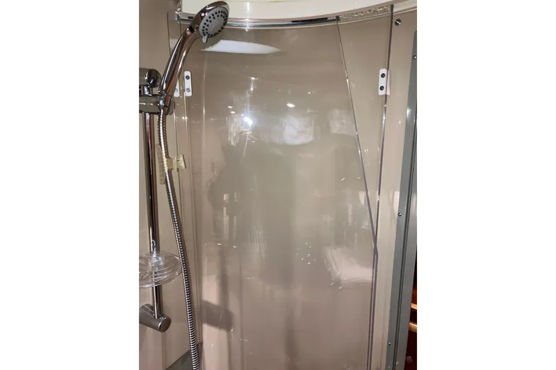 Slide: The Image of Shower area in 2017 Cutwater C-30 Sedan boat with chrome fixtures. - 73