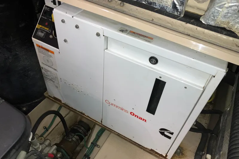 Slide: The Image of Cummins Onan generator in 2017 Cutwater C-30 Sedan boat engine compartment. - 87