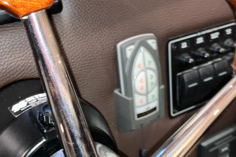 Slide: The Image of Control panel of 2017 Cutwater C-30 Sedan boat with steering wheel and switches. - 63