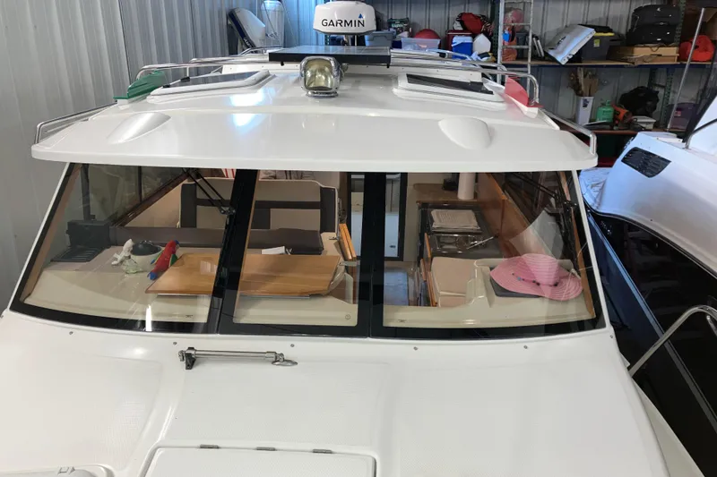 Slide: The Image of 2017 Cutwater C-30 Sedan boat interior with Garmin equipment in a storage facility. - 92