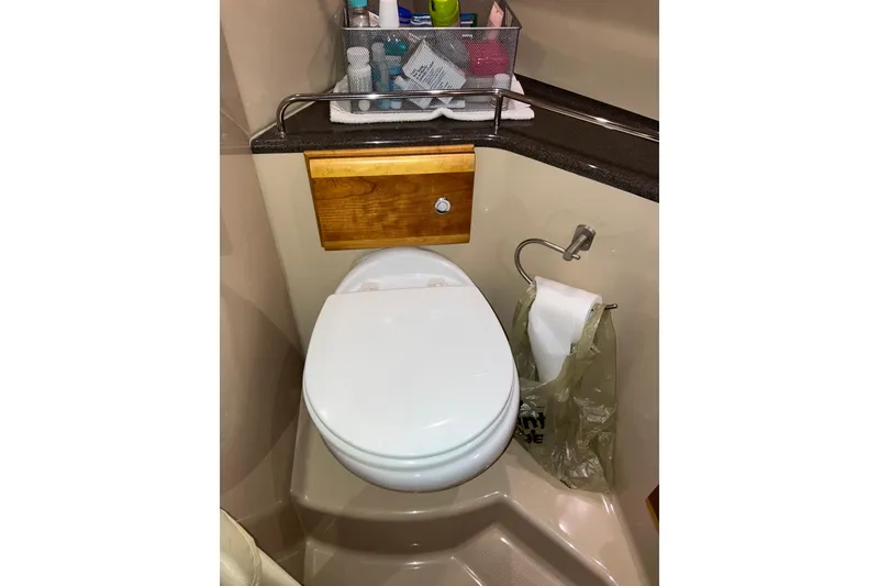 Slide: The Image of 2017 Cutwater C-30 Sedan boat bathroom with toilet and toiletries. - 72
