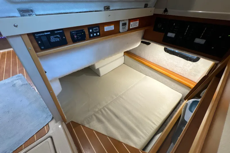 Slide: The Image of Interior cabin of 2017 Cutwater C-30 Sedan boat with control panels and cushioned seating. - 26