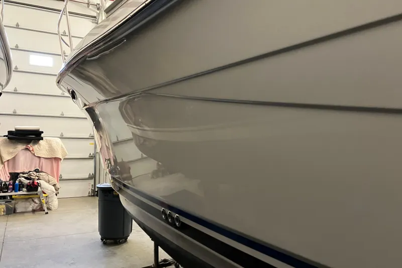 Slide: The Image of 2017 Cutwater C-30 Sedan boat in a garage, side view. - 5