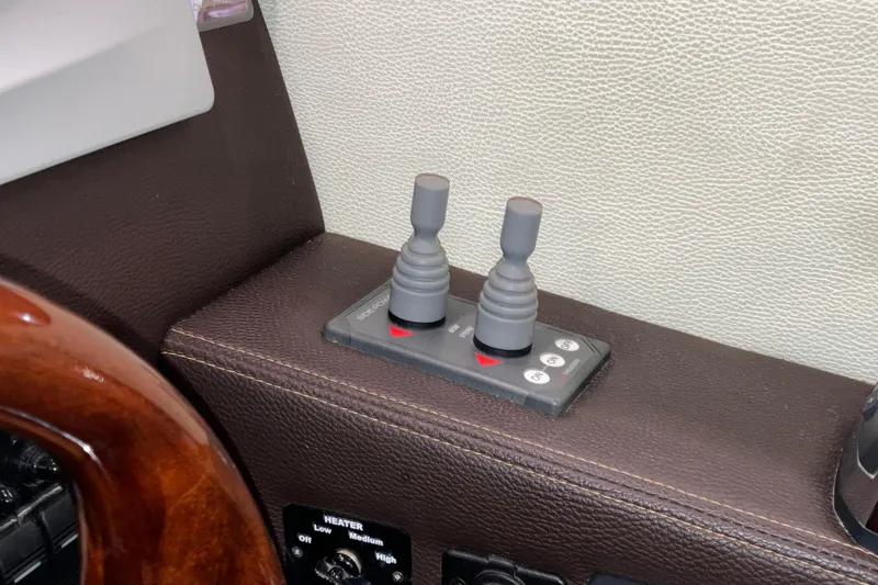 Slide: The Image of Control panel of a 2017 Cutwater C-30 Sedan boat with dual joysticks. - 60
