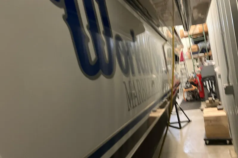 Slide: The Image of 2017 Cutwater C-30 Sedan in storage, side view with visible lettering. - 109