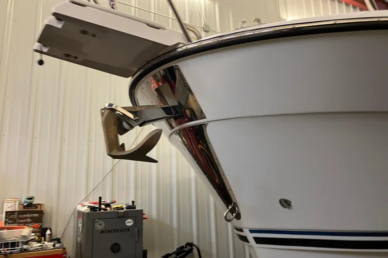 Slide: The Image of 2017 Cutwater C-30 Sedan boat bow with anchor in indoor storage. - 4