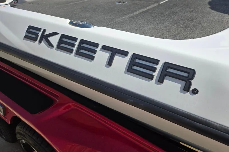 Slide: The Image of 2020 Skeeter FXR21 Limited boat logo on white and red surface. - 11