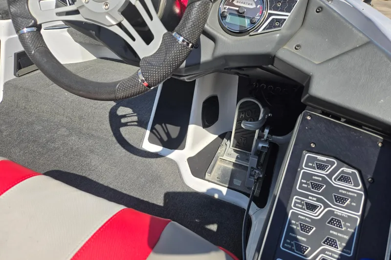 Slide: The Image of 2020 Skeeter FXR21 Limited boat cockpit with steering wheel and control panel. - 13