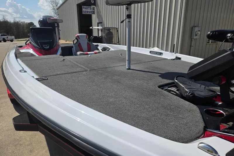 Slide: The Image of 2020 Skeeter FXR21 Limited boat with spacious deck and modern seating. - 14