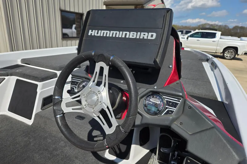Slide: The Image of 2020 Skeeter FXR21 Limited boat dashboard with Humminbird display and steering wheel. - 16