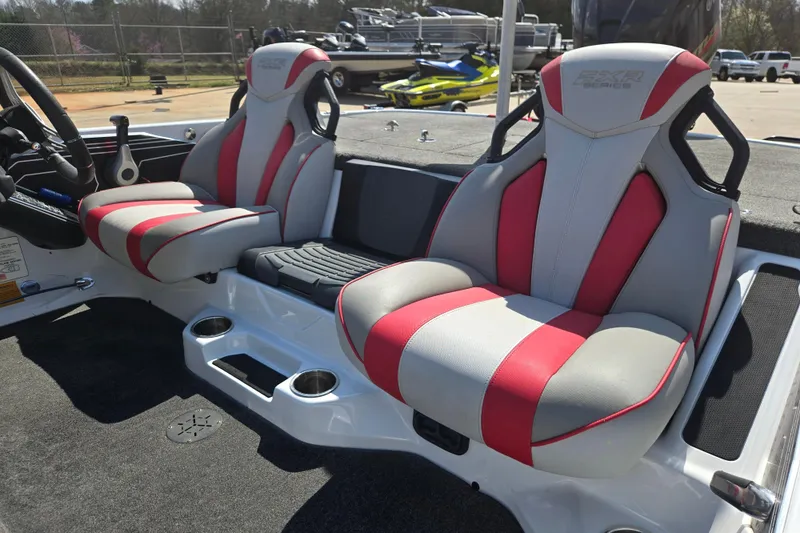 Slide: The Image of 2020 Skeeter FXR21 Limited boat seats with red and gray design, showcasing luxury and comfort. - 7