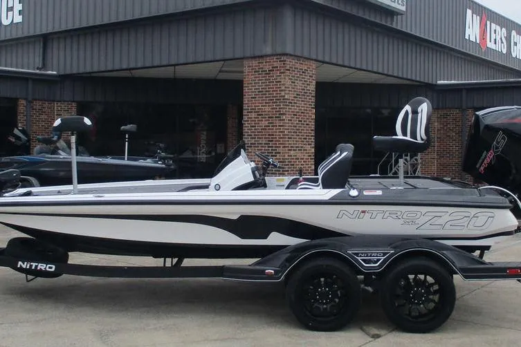 The Image of 2026 Nitro Z20 XL Pro boat on trailer outside dealership. - 1