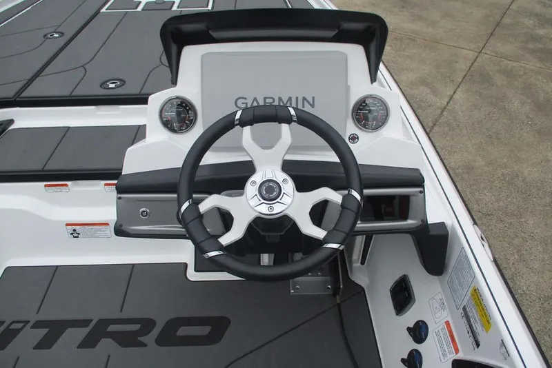 Slide: The Image of Steering console of 2026 Nitro Z20 XL Pro boat with Garmin display and gauges. - 11
