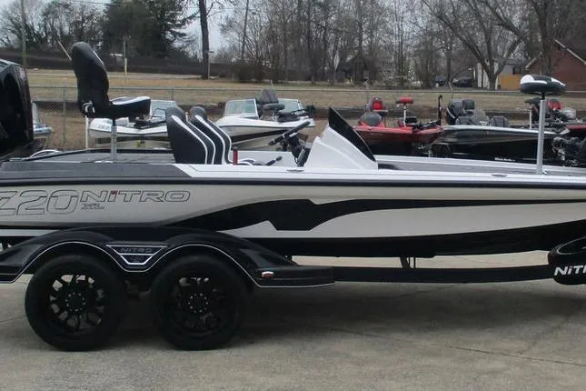 Slide: The Image of 2026 Nitro Z20 XL Pro boat on trailer, sleek design, parked outdoors. - 7