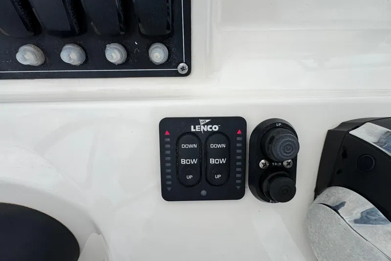 Slide: The Image of Control panel of a 2016 Boston Whaler 210 Montauk boat with Lenco trim tabs. - 19