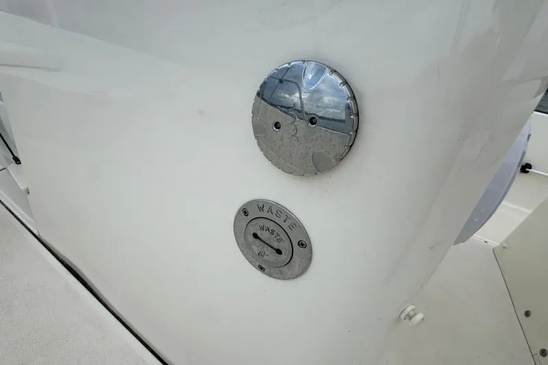 Slide: The Image of Boston Whaler 210 Montauk 2016 boat waste access panel and cap. - 26