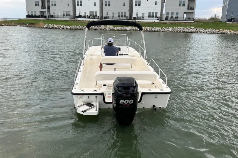 Slide: The Image of 2016 Boston Whaler 210 Montauk boat with 200 HP engine on water. - 6