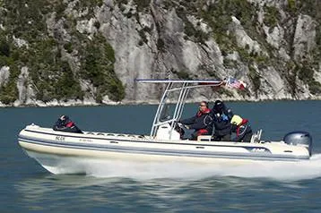 The Image of Manufacturer Provided Image: AB Inflatables Oceanus 24 VST 2026 cruising near rocky coastline. - 0