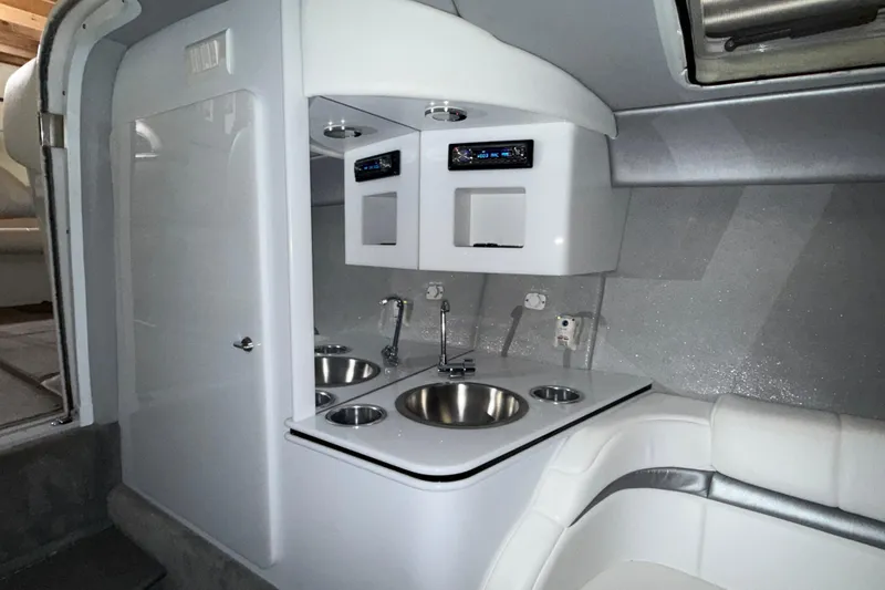 Slide: The Image of 2005 Formula 353 FASTech boat interior with modern kitchenette and seating area. - 11