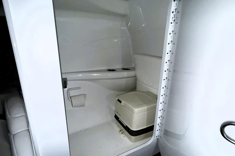 Slide: The Image of 2005 Formula 353 FASTech boat interior with compact bathroom and portable toilet. - 13