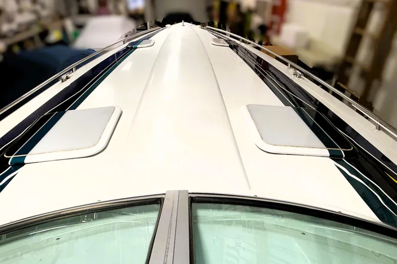 Slide: The Image of 2005 Formula 353 FASTech boat deck, sleek design, white with blue accents. - 16